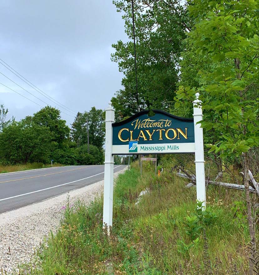 Welcome to Clayton sign on the side of the road.